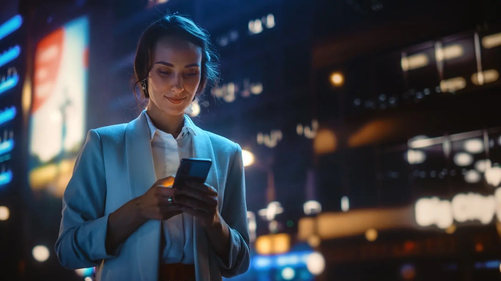 A woman looking at the mobile screen