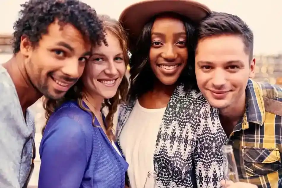 Multi-ethnic millenial group of friends taking a selfie photo with mobile phone on rooftop terrasse at sunset_11zon_11zon