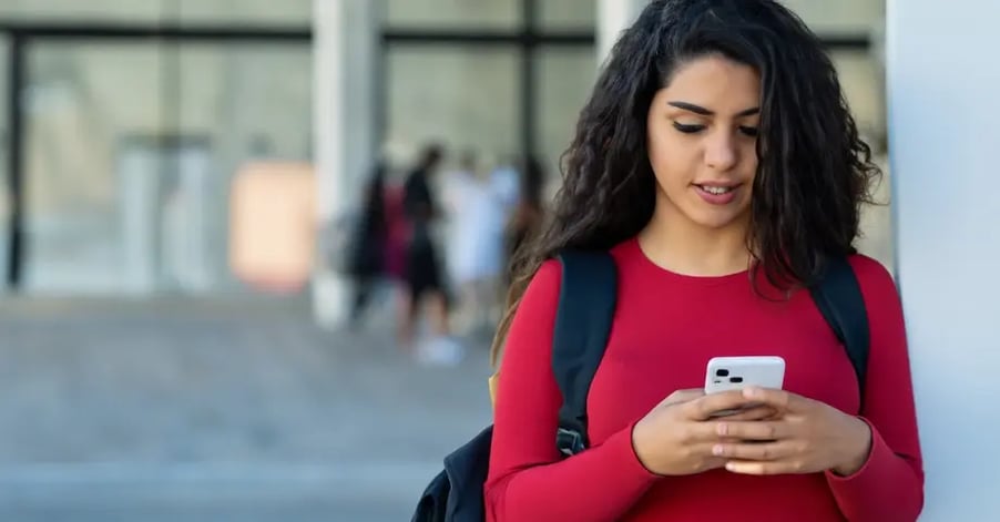 college-student-in-red-shirt-texting