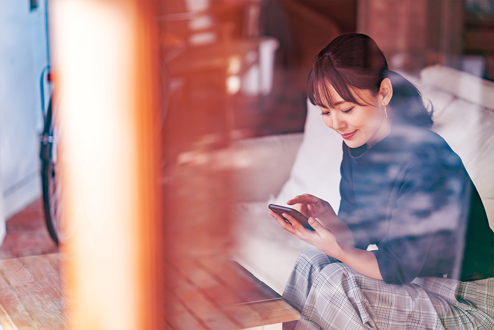 female-indoors-looking-at-mobile-phone