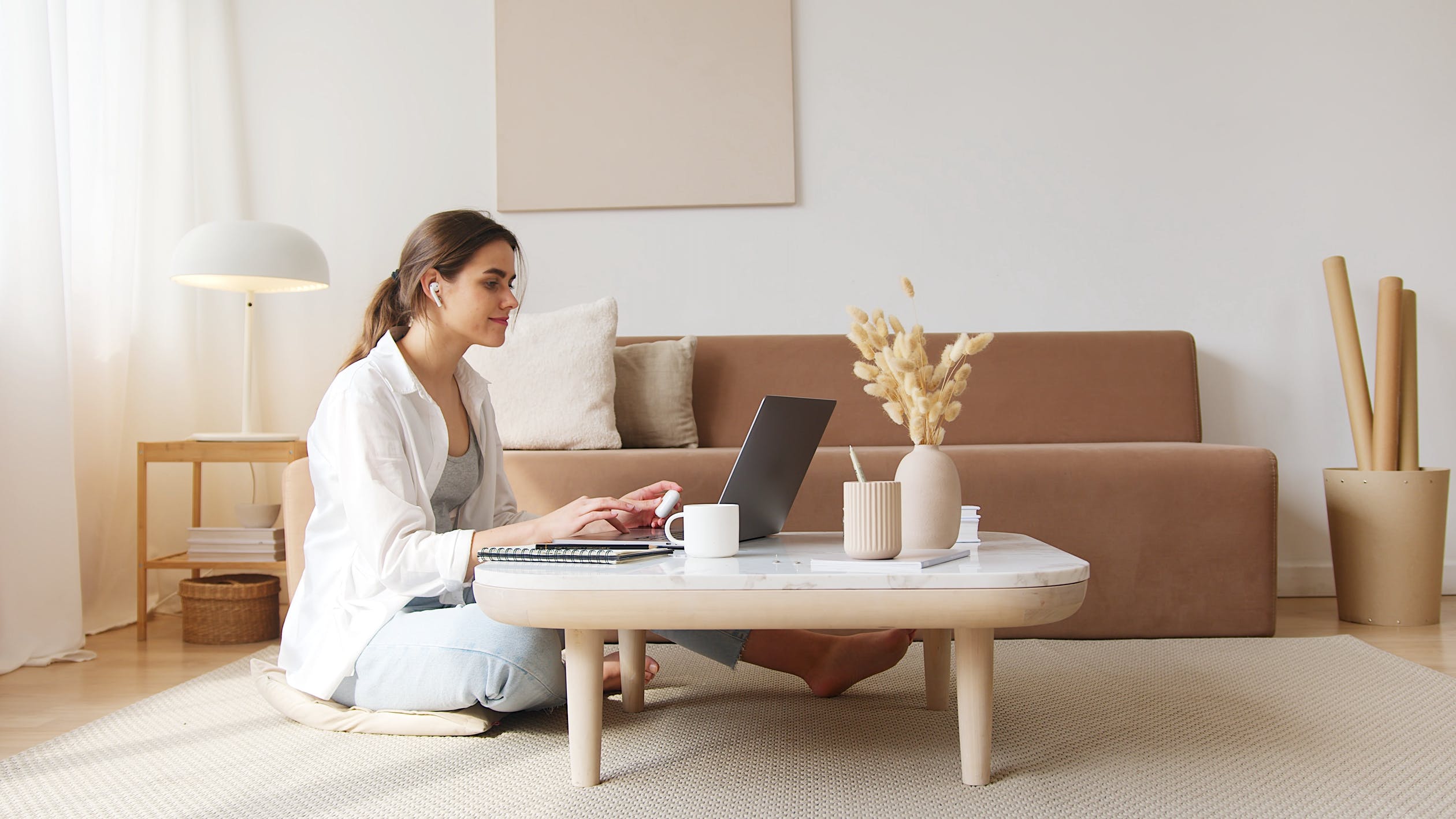 Young woman using the laptop in the meeting